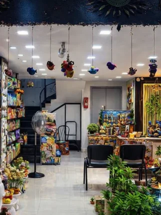 Interior of Gayatri Nursery Amravati showcasing plants, decorative items, and garden accessories.